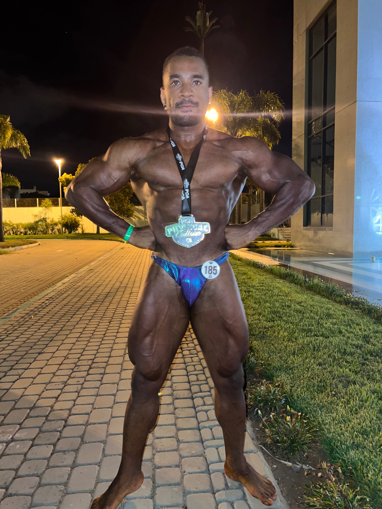 Youness Daifi wearing a bodybuilding competition medal